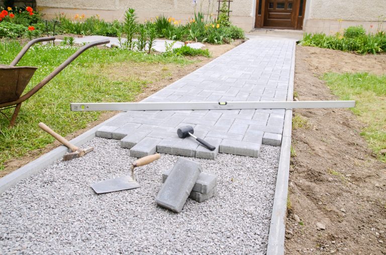 masonry walkway being installed in front yard.